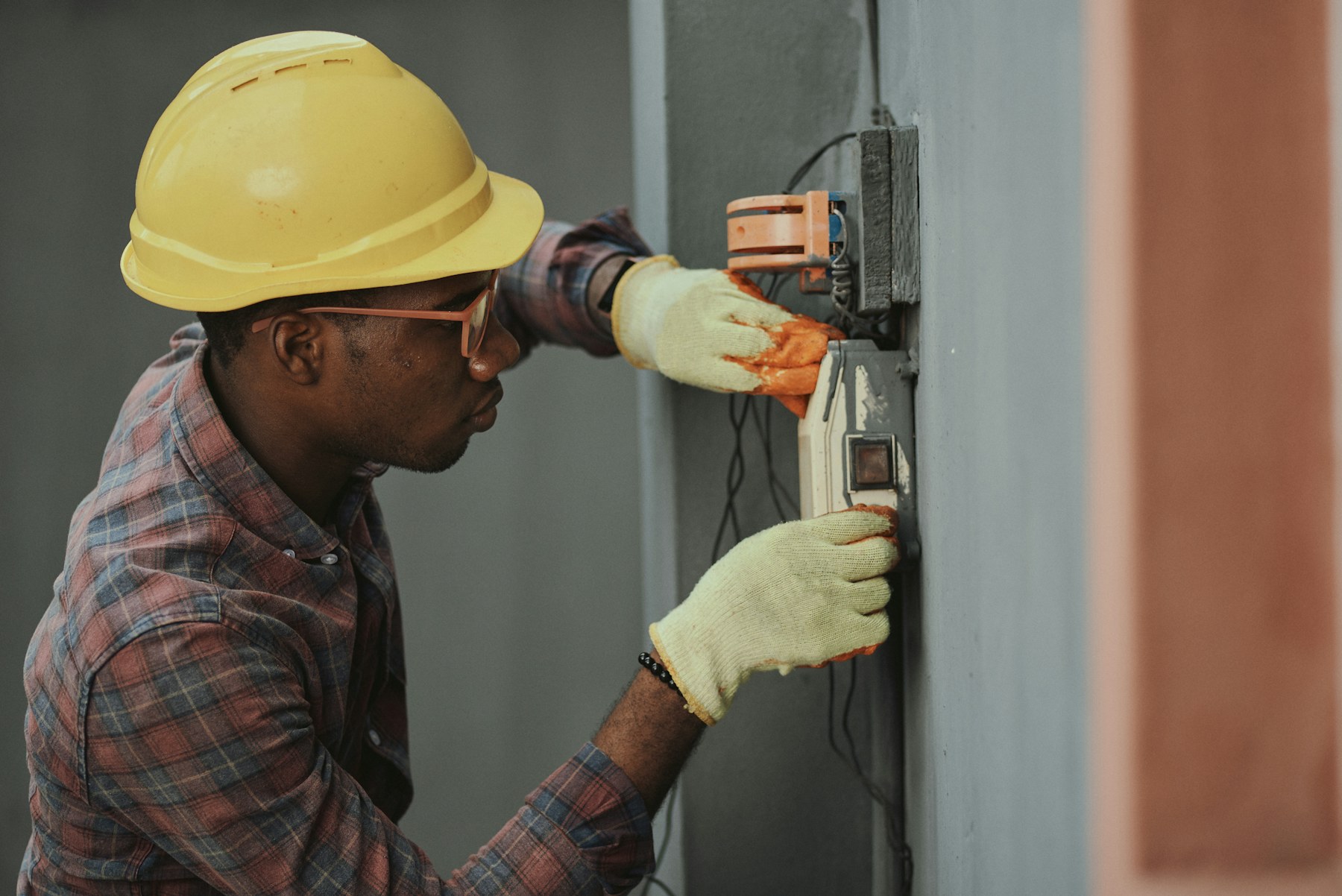 Electrician working on residential electrical equipment